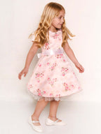Abito in fantasia con fiori e tulle