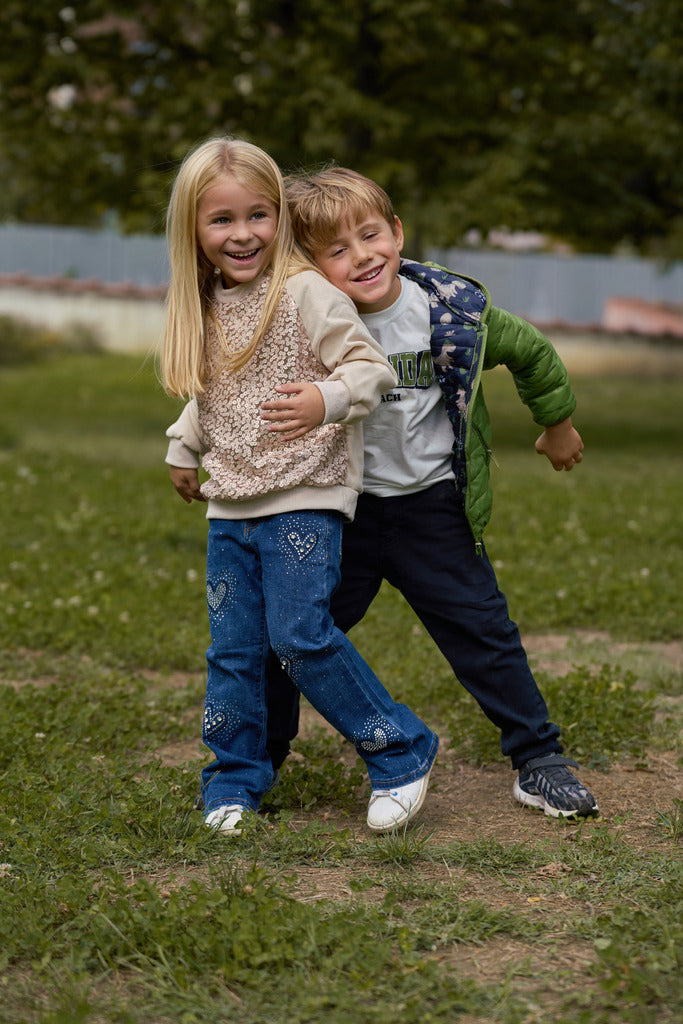 Jeans bambina con decorazione cuori
