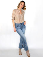 Jeans a zampa con fiocchetti