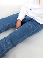 Jeans con cuori e perlina