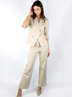 Pantalone a zampa con bottone gioiello
