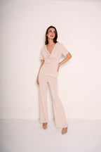Pantalone con risvolto in vita e strass