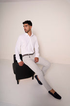 Pantaloni slim fit con ciondolo
